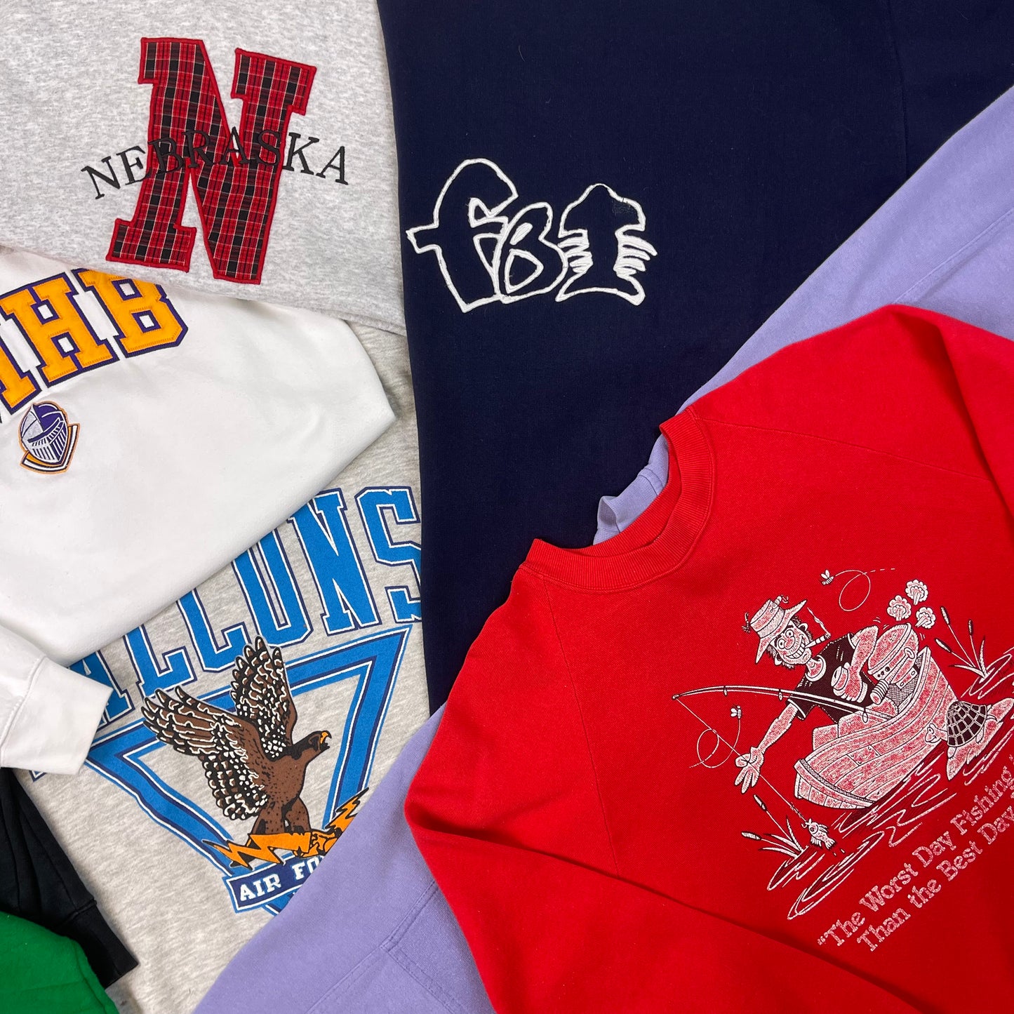 Collection of various t-shirts with different designs and text.